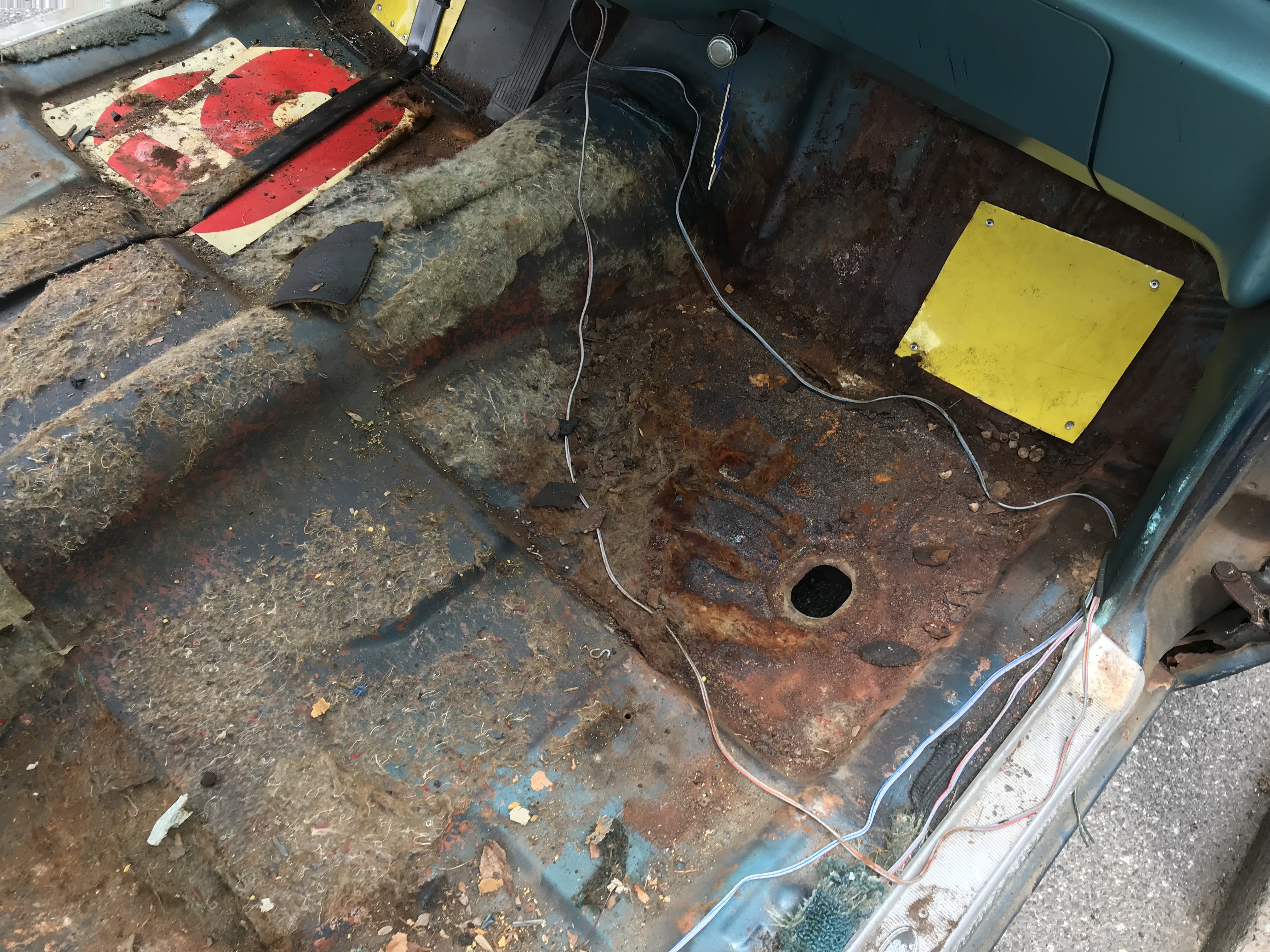 front passenger side of the floor, notice the yellow scrapmetal patchwork